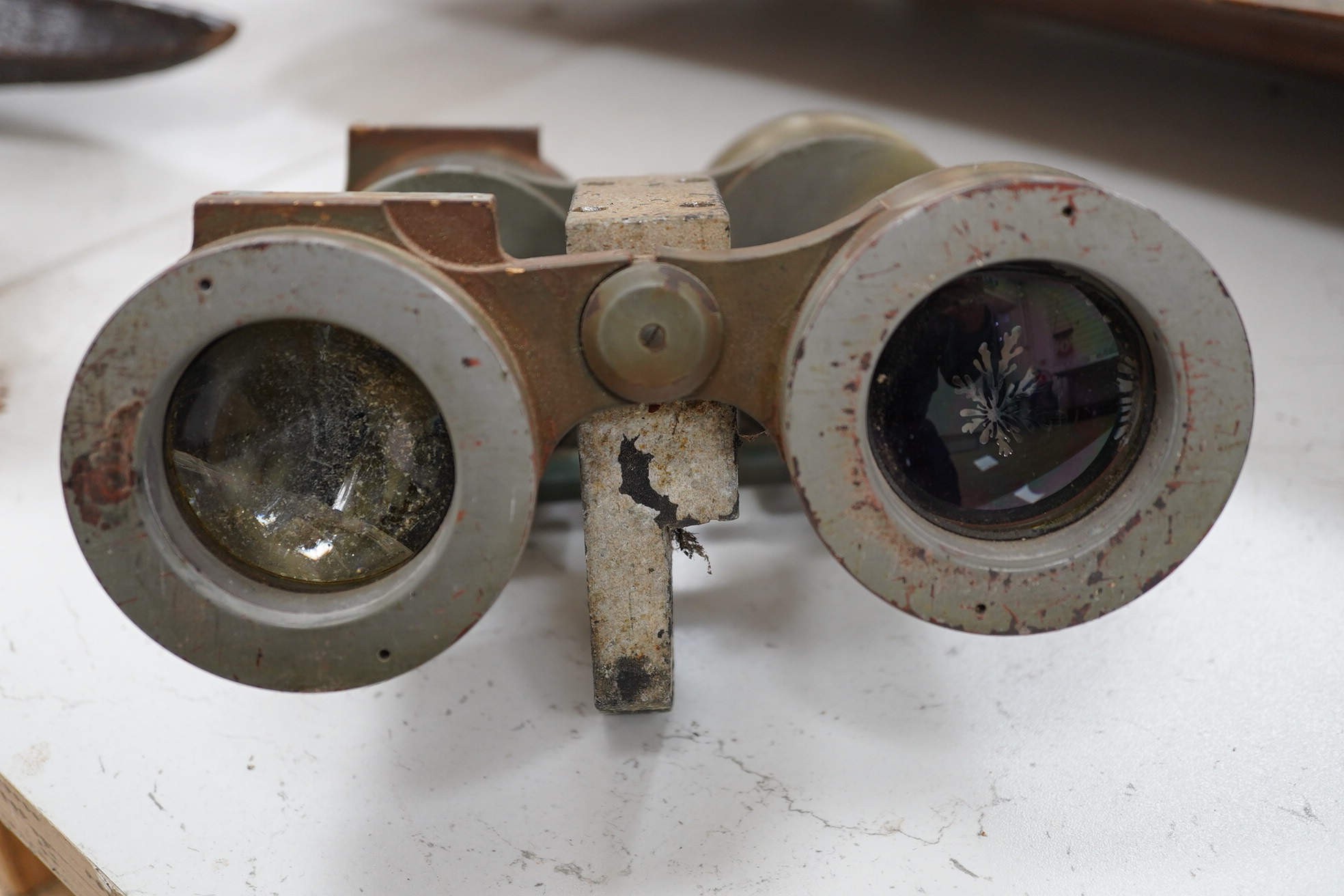 A pair of WWII German U boat coning tower binoculars stamped; U.D.F. 7x50 317971 blc, 20.5cm long. Condition - poor, all lenses damaged, one shattered, and general wear overall.